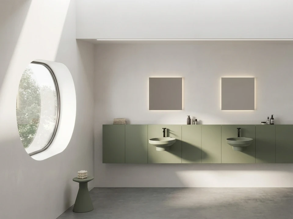 Photographie d'un intérieur haut de gamme finement aménagé, montrant un espace living ou cuisine-séjour contemporain avec des matériaux et finitions premium (carrelage sophistiqué, revêtements de sol élégants, mobilier design). L'image doit mettre en avant le savoir-faire et l'attention aux détails : agencements sur mesure harmonieux, palette de couleurs raffinée, matériaux de qualité supérieure et ambiance lumineuse valorisant les finitions. Une pièce complètement rénovée et décorée, reflétant l'excellence et l'exclusivité du concept, sans texte ni logo visible.